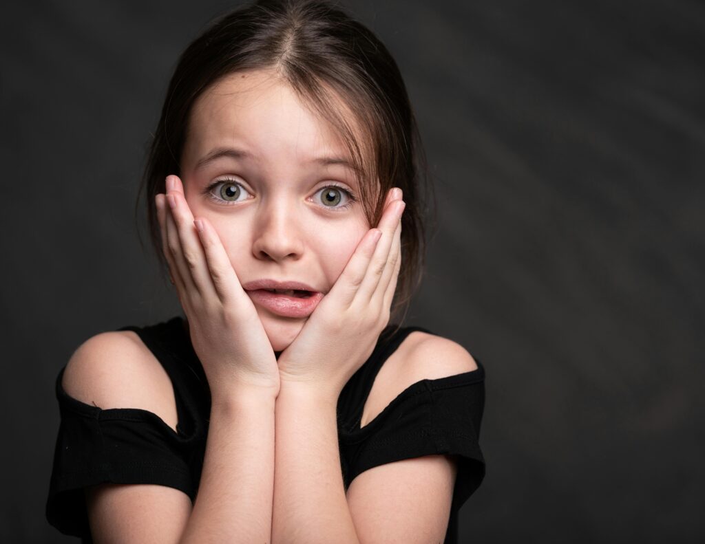 Girl in Black Top Looking Surprised